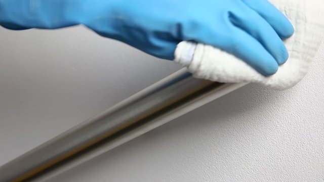 Cleaning interior with spray alcohol, disinfect surface of steel railing