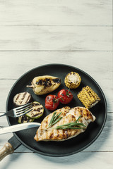 Fried chicken fillet and boiled vegetables