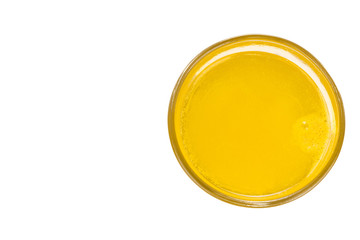 Overhead view of glass of prepared orange flavored vitamin c effervescent