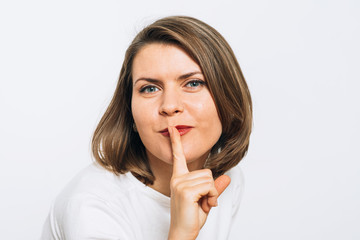 Naklejka premium woman put finger on her lips