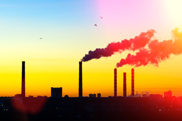 concept of environmental pollution by factories. selective focus. Smoke from factory chimneys in an urban environment. Concept environmental pollution, ecology