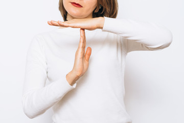 Girl making time out gesture