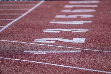 Fototapeta premium Red running sport track background and texture. Sport running track concept.