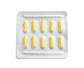 Blister pack with pills on white background