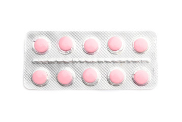 Blister pack with pills on white background