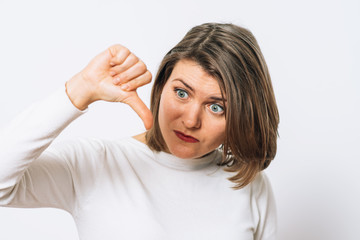 Woman showing a thumb down gesture