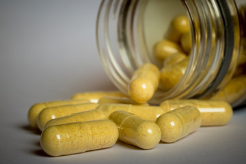 yellow pills in a jar