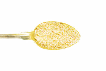 Sugar on brass spoon isolated on white background with clipping path