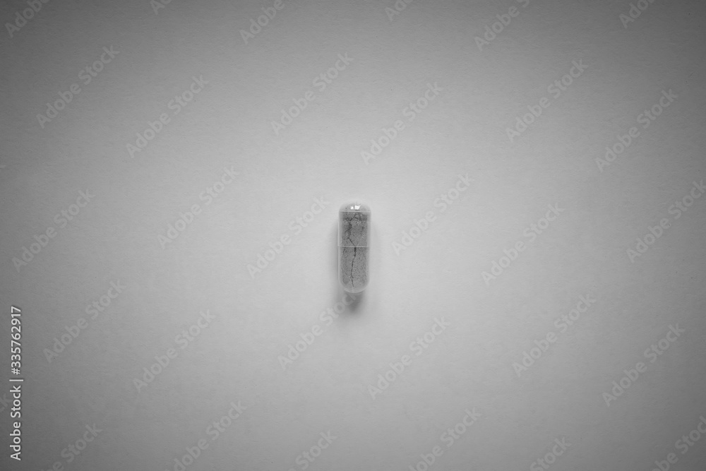 Wall mural one colorless pill on a plain background