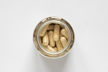 yellow pills in a jar