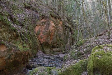 City Sigulda, Latvia. Historic sand cliffs and river. Travel photo.