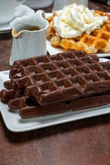 Tasty Belgian dessert, Brussels waffles with chocolade and whipped cream