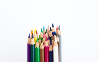 colored pencils on white background