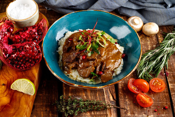 beef cheeks stewed in sauce with mashed potatoes