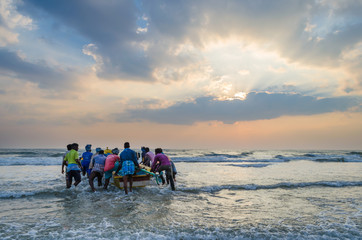 Fishermen going to fishing from the shores of Mamallapuram aka Mahabalipuram in Tamil Nadu, India
