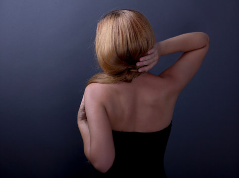 Beautiful female back. Portrait of a long haired woman. Back.