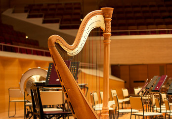 Harp in a large concert hall. Musical instrument.The concert harp