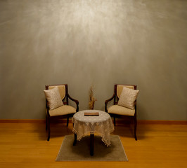 Modern seating arrangement with empty wall facade in the background shot for artists to place their painting frames.  © Jim