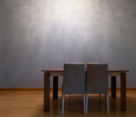 Modern seating arrangement with empty wall facade in the background shot for artists to place their painting frames.  © Jim