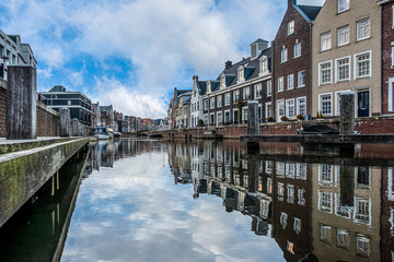 Naklejka premium Houses along side a canal in a typical dutch city