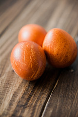 Delicious Easter eggs of guinea hen on a wooden background to the traditional Easter feast.