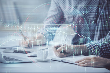 Multi exposure of forex chart with man working on computer on background. Concept of market analysis.