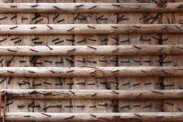 Brown wood wall with nail patterns on the wall texture background - loft style