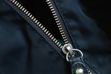 zipper on the jacket closeup as background © Виктория Котлярчук