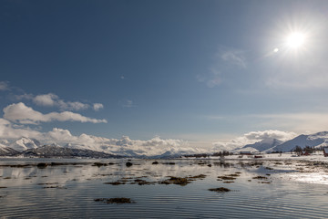 Fototapeta na wymiar winter landscape with lake and mountains