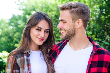 Fototapeta premium Love you more than yesterday. couple in love. Hiking. family weekend. romantic date. man and woman in checkered shirt relax in park. valentines day. summer camping in forest. hipster couple outdoor