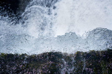 Mountain waterfall in the forest, a large noisy stream of water
