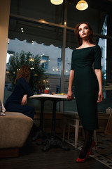 Two girls quarrel, bicker in tha cafe