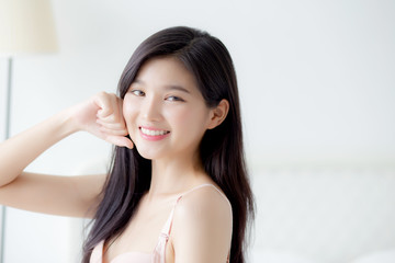 Beautiful portrait young asian woman sexy in underwear figure fit relax with seductive in bedroom, beauty asia girl body slim in lingerie confident and happy stand in bedchamber, lifestyle concept. © NT_studio