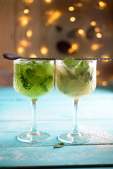 A glass of lemon soda with fresh mint