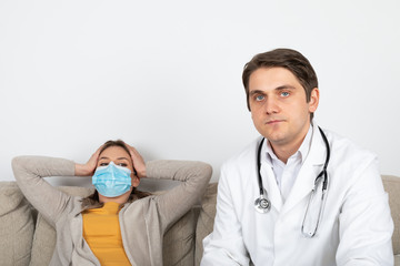 Doctor consulting female patient at home