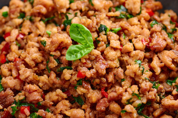 Pad Krapow Gai - Thai Basil Chicken close up. Pad Krapow is Thai cuisine dish with minced chicken...