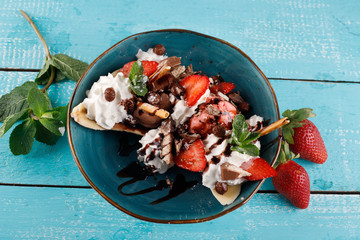 dessert with ice cream with fresh berries on a plate