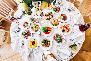 top view of table set at a wedding reception. delicious dishes a