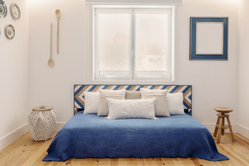 Modern apartment interior design in blue colours,  small and cozy bed room with kitchen Portuguese style