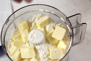 Diced butter and flour in Food Processor Cup