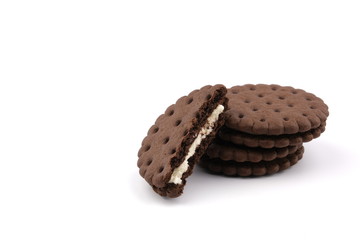 chocolate cream sandwich cookies with cream filling on a white background