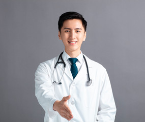 Portrait of male asian young doctor  with handshake gesture