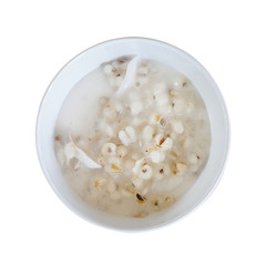 Top view of Job's tears  or Adlay millet seeds isolated on white background. Boiled of job's tears with coconut milk, Thai dessert with clipping path.