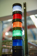A set of industrial factory traffic lights indicating various production completions and indicating...