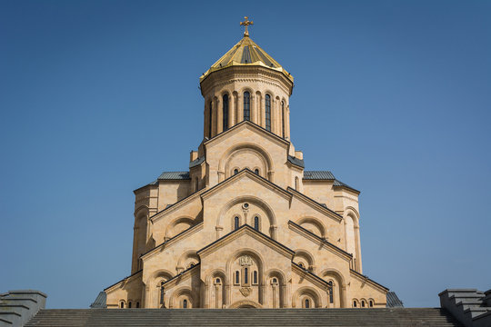 Front view of Holy Trinity Cathedral of Tbilisi also known as Tsminda Sameba, orthodox church in sunny day, Georgia