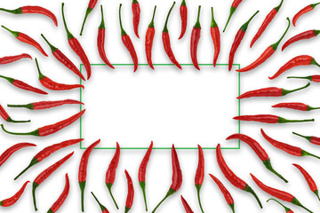 Rectangular frame of red chili pepper pods on a white background