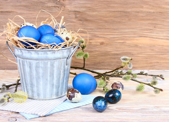 Easter. Blue eggs on a wooden background