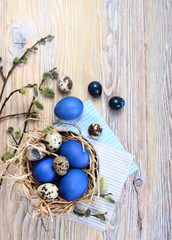 Easter. Blue eggs on a wooden background