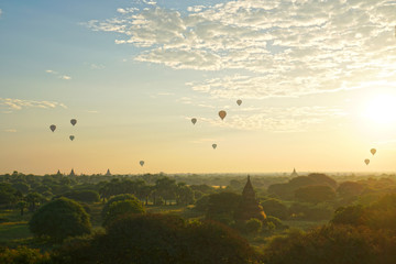 Landscape of ancient pagoda and balloon floating over the orange sky sunrise in the morning at Bagan , Mandalay , Myanmar - Scenery background