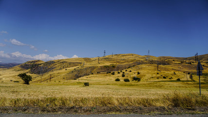 Fototapeta premium Mountain view road at sunset